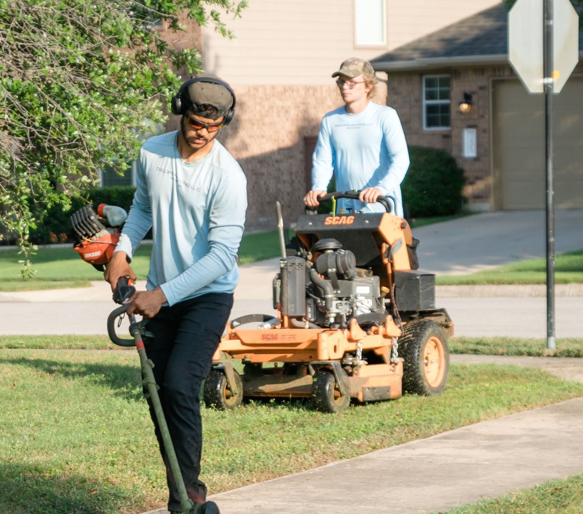 The Troops Mowing crew mowing a customer’s lawn